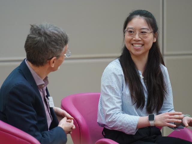 Doudou Cao speaking with Sir John Aston