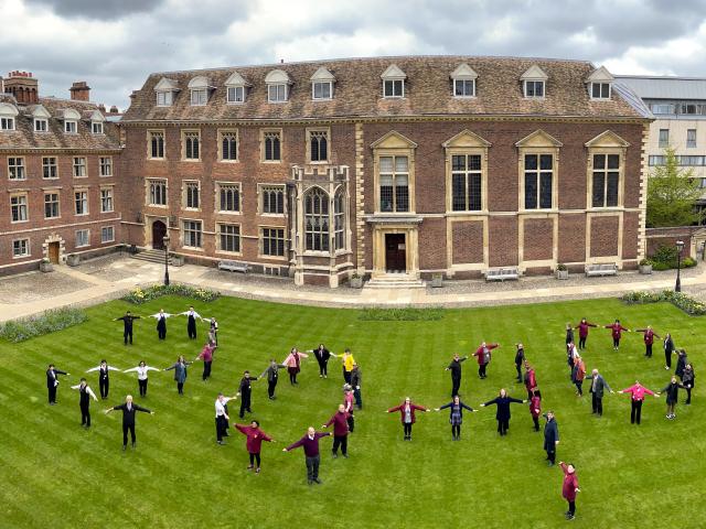 People standing in Main Court at St Catharine's College in the shape of '2040'