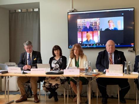 Dr Gilly Carr with Lord Pickles and other experts speaking at the presentation of the Alderney expert review