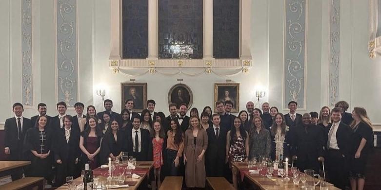 Group photo in Worcester College's Hall of the 2023 Worcester-St Catharine's postgraduate swap 